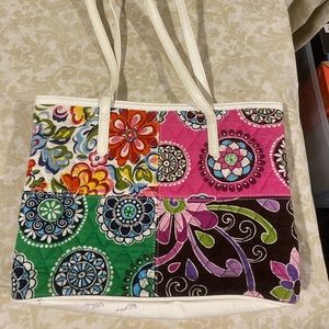 Vera Bradley patchwork purse with white patent leather handles-straps.
